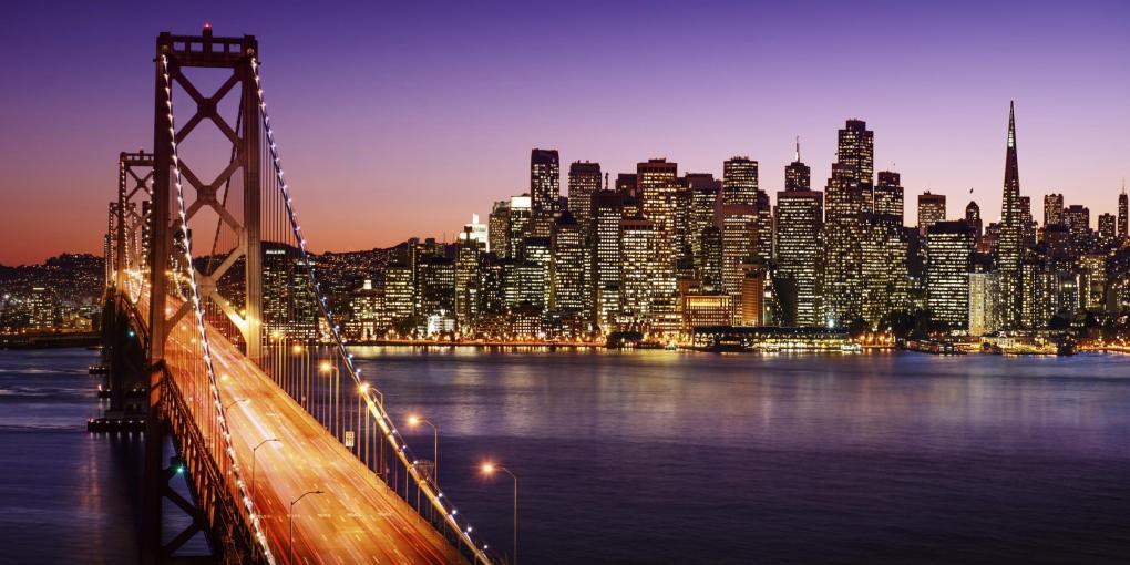 San Francisco, CA skyline and Bay Bridge at sunset